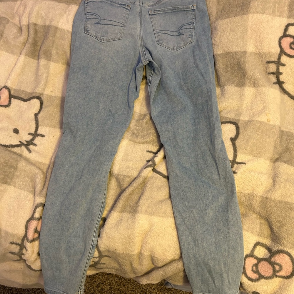 Light blue ripped American Eagle skinny jeans